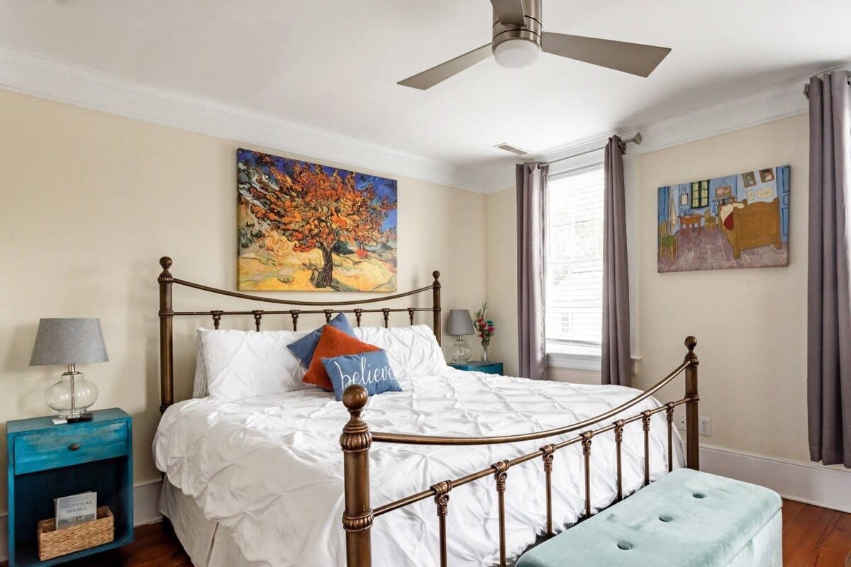 Van Gogh prints & rich hardwood floors create a warm, inviting atmosphere